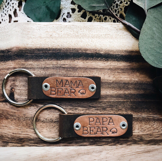 leather keychain stamped "mama bear" and "papa bear"